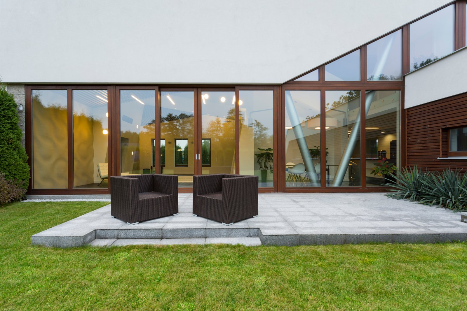 Villa patio with rattan chairs Three-bedroom family home
